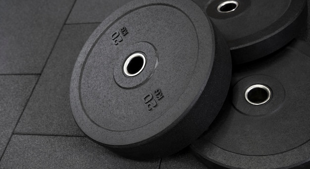 Free Photo high angle of weights on the floor at the gym