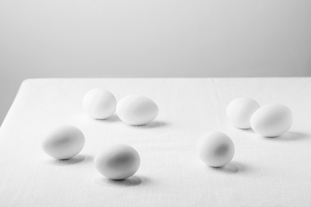 High angle white chicken eggs on tablecloth