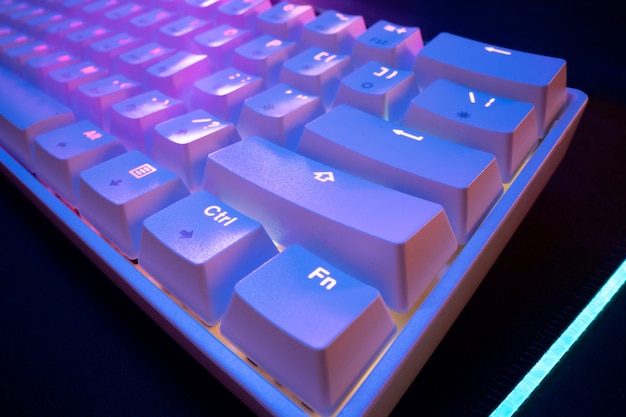 Free photo high angle white keyboard with lights