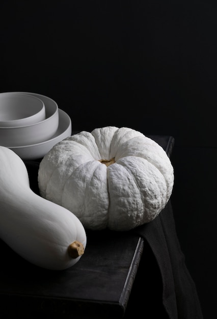 High angle white pumpkins and dark background