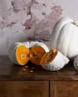 Free photo high angle white pumpkins on table