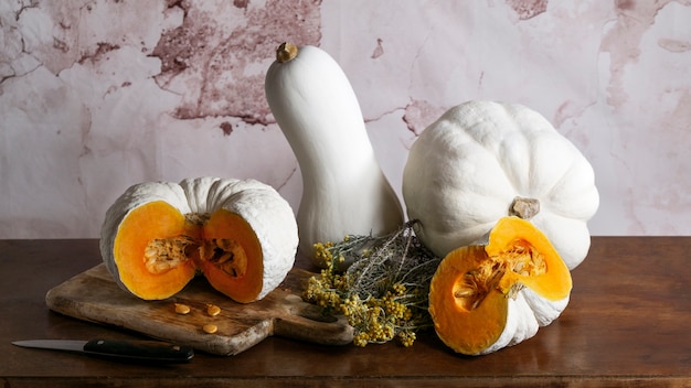 Free photo high angle white pumpkins on wooden table