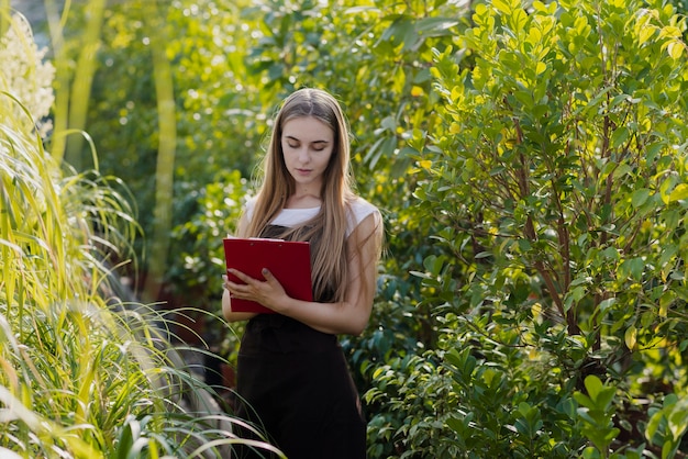 High angle woman checking clipboard list