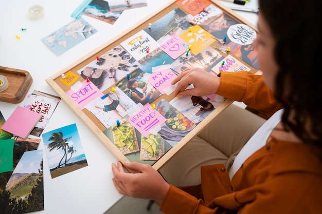 Free Photo high angle woman creating inspiring vision board