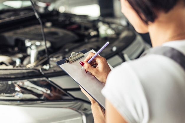 High angle woman feeling car service form