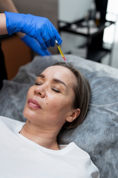 High angle woman getting prp treatment