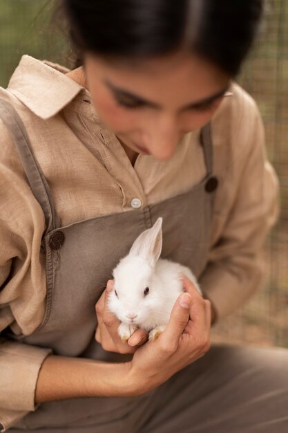 High angle woman holding bunny