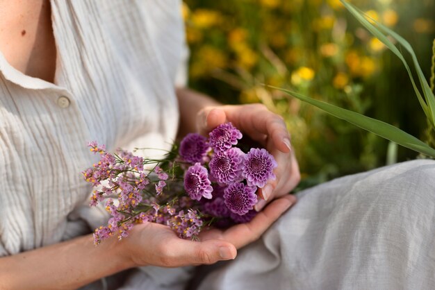 High angle woman holding flowers