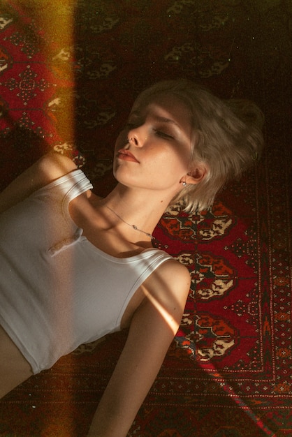 Free Photo high angle woman laying on floor