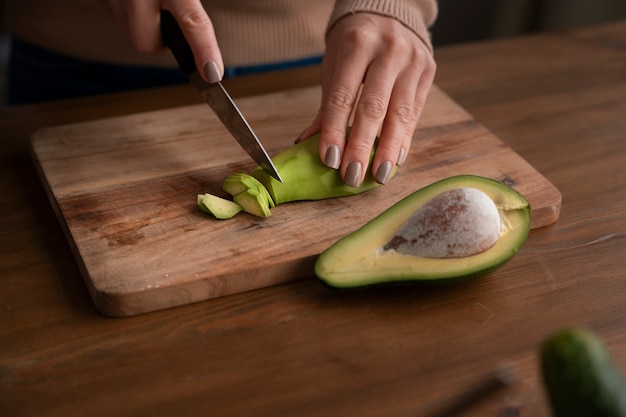 High angle woman learning to make sushi