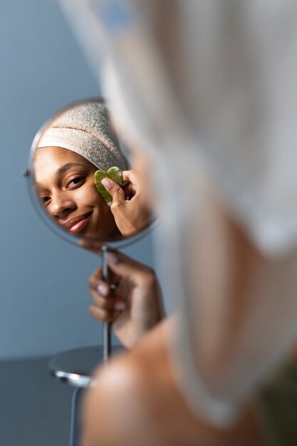 High angle woman looking in mirror