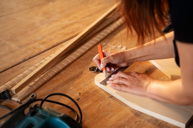 High angle woman measuring with ruler