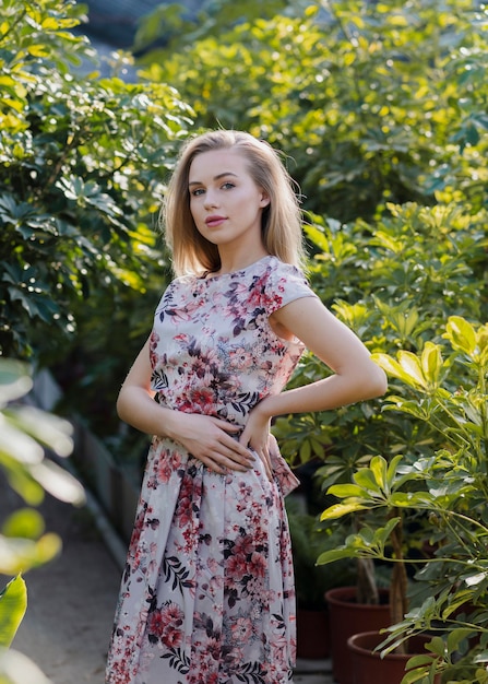 High angle woman in the middle of plants foliage