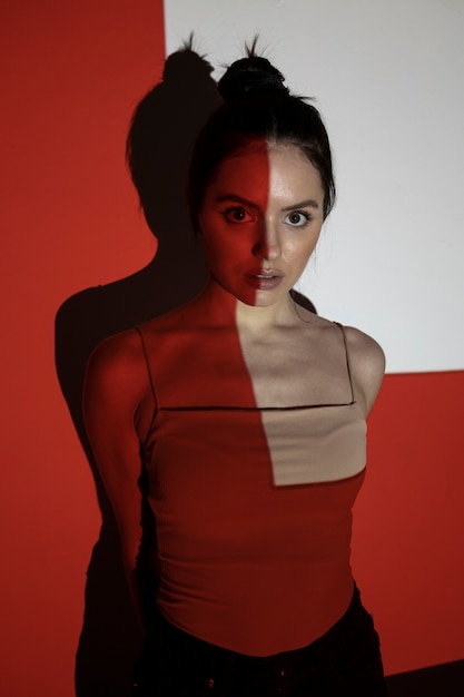 High angle woman posing with projector