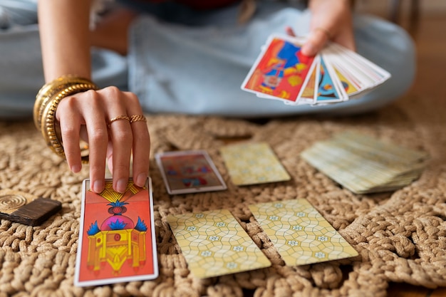 High angle woman reading tarot at home