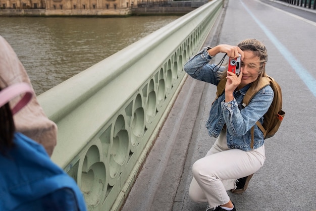 Free Photo high angle woman taking photos