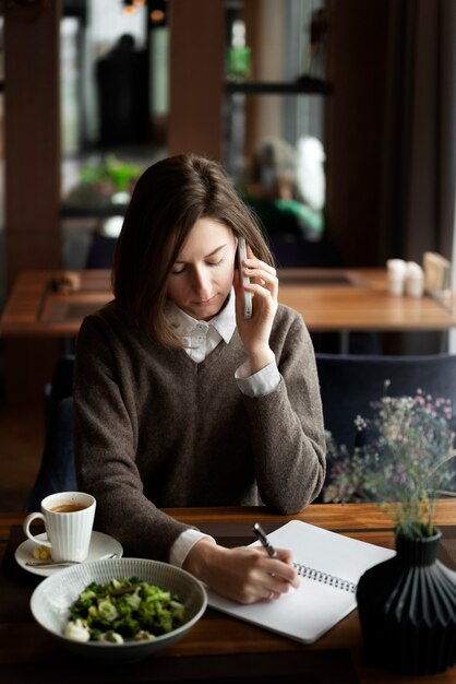 High angle woman talking on phone