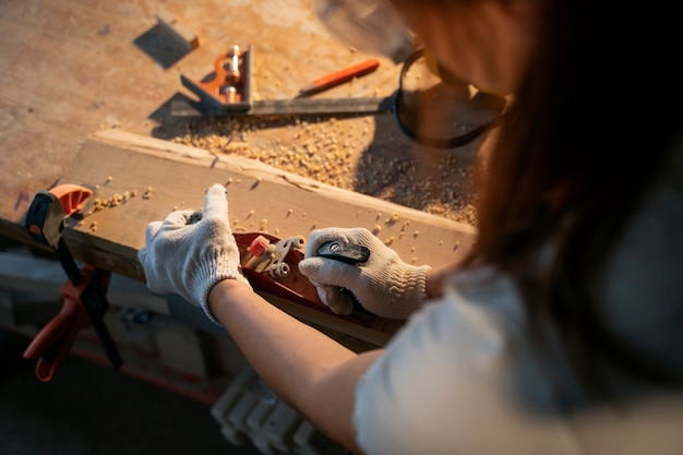 High angle woman wearing protection gloves