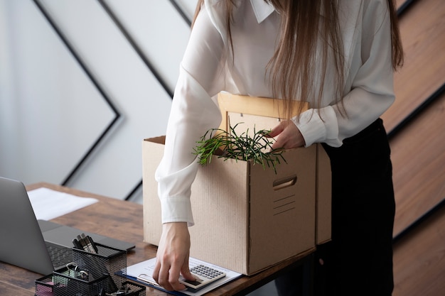 High angle woman with cardboard box