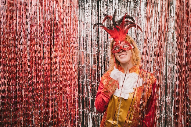 Free photo high angle woman with mask at carnival party