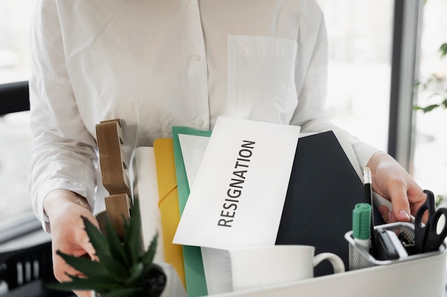 High angle woman with resignation letter