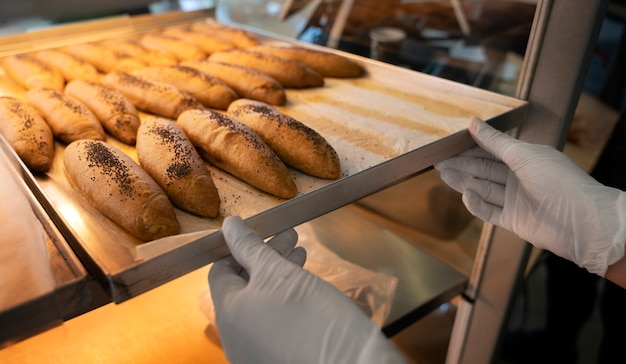 Free photo high angle woman working in bakery