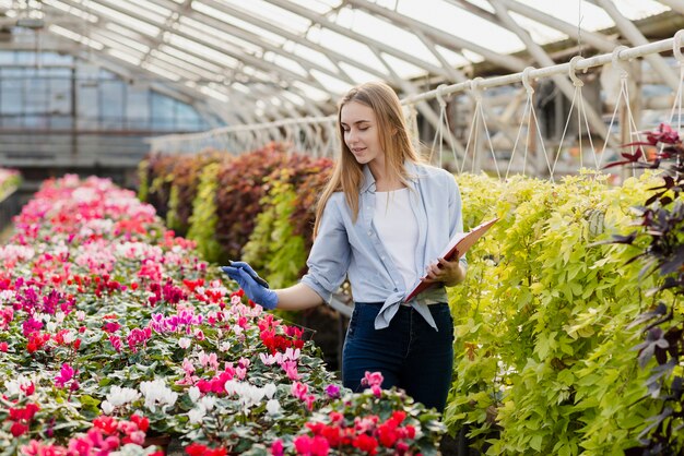 High angle woman working in greenhouse