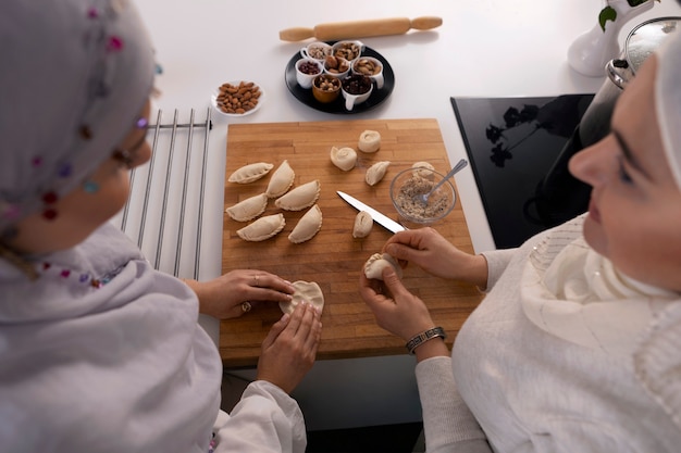 High angle women cooking for ramadan