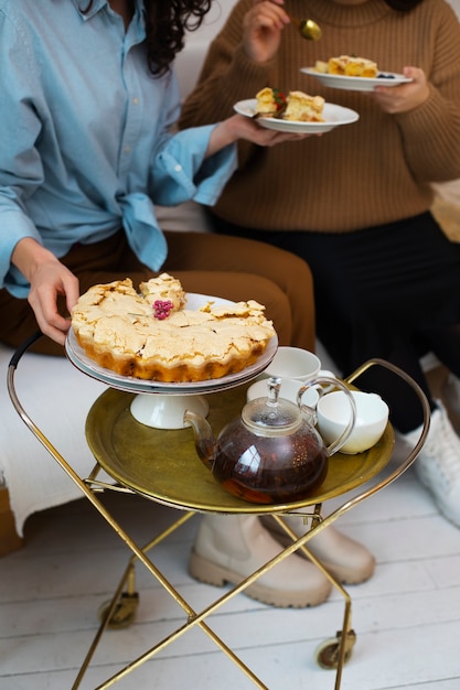 Free photo high angle women enjoying delicious food