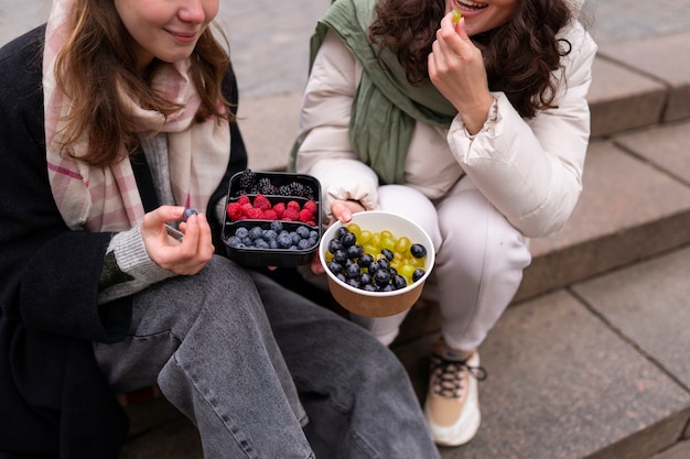 High angle women with berries