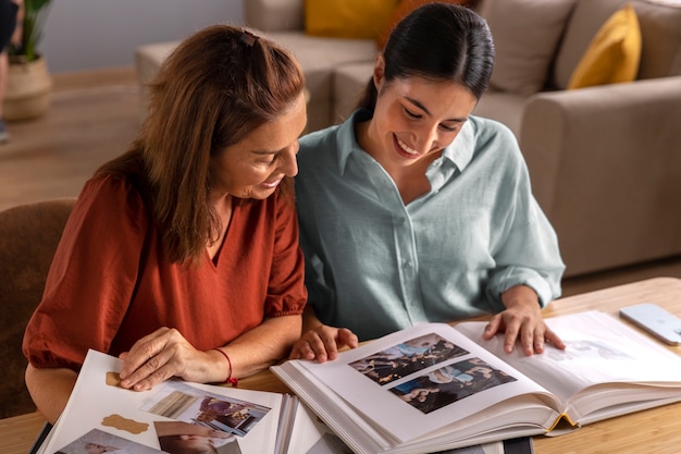 High angle women with picture albums