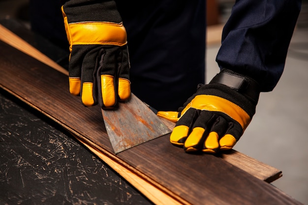 Free photo high angle worker wearing safety gloves