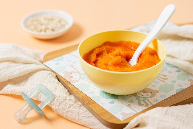 High angle yellow bowl with baby food