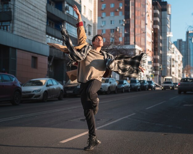 High angle young ballet dancer performing outdoor