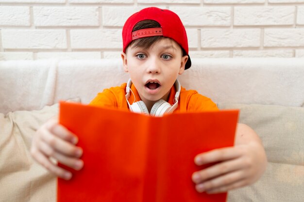 Free photo high angle young boy reading