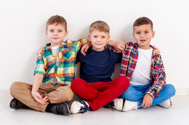 Free photo high angle young boys at book day