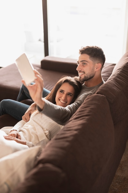 Free photo high angle young couple taking selfie