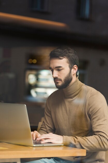 High angle young entrepreneur working