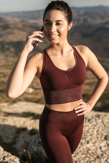 High angle young female talking over phone