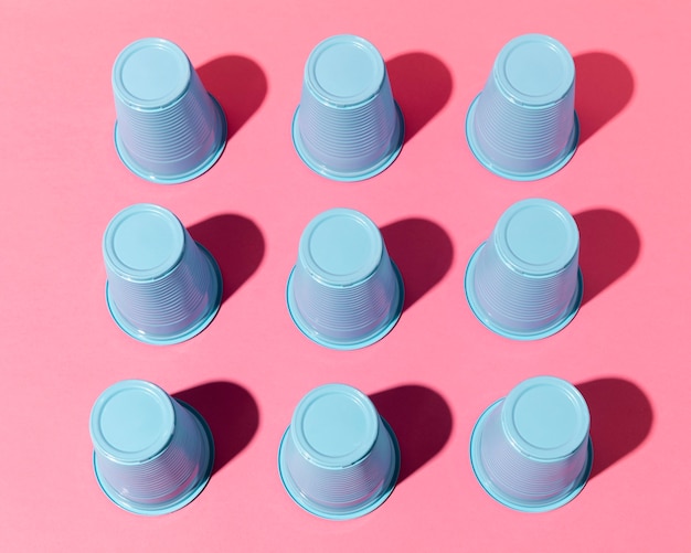 High view blue plastic cups with shadows