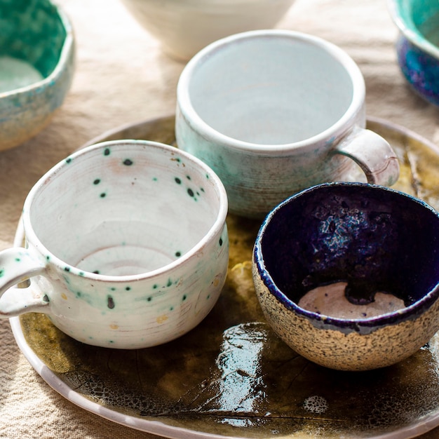 Free Photo high view bowls and mugs pottery concept