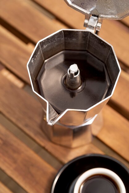 High view coffee kettle with wooden background