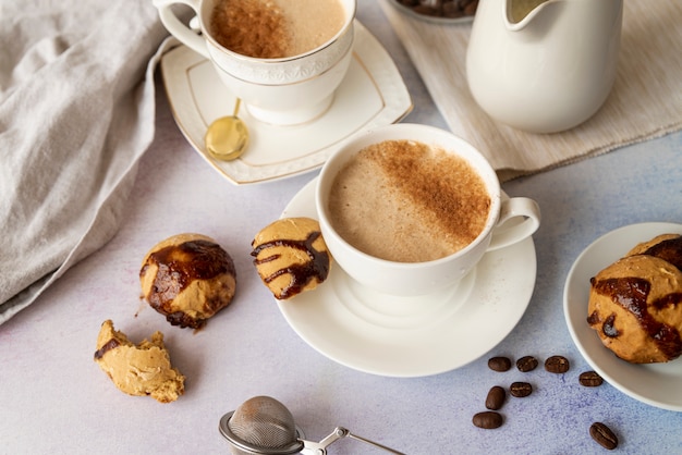 High view of cup of coffee and sweets