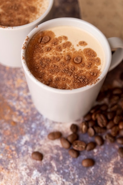 High view cup of coffee with cocoa powder