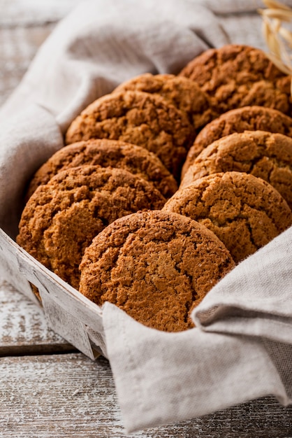 Free Photo high view delicious cookies in cloth and basket