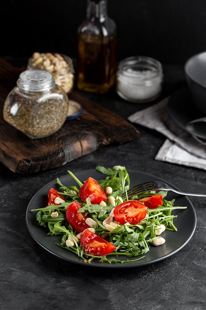 Free photo high view delicious salad on dark plate