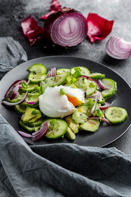 High view delicious salad with dark tableware