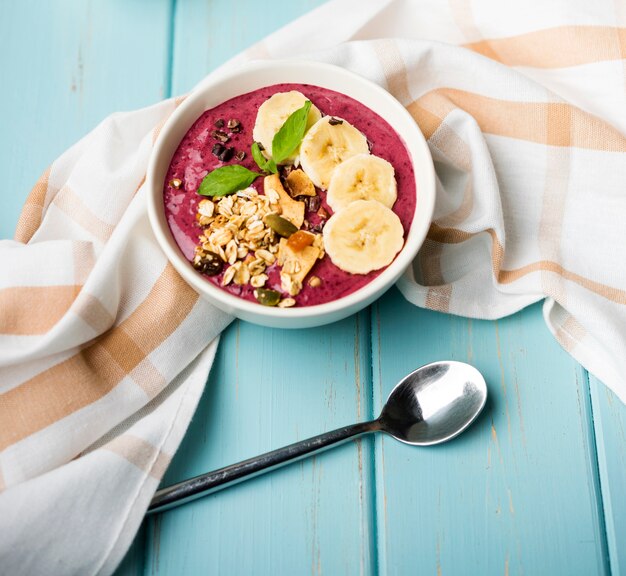 High view healthy bowl of food with slices of banana