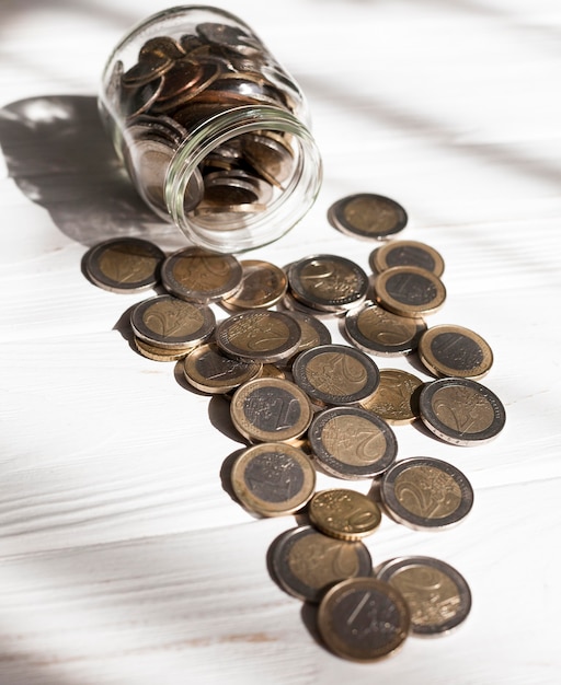 Free Photo high view jar full of euro coins