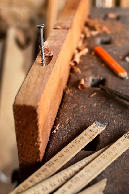 Free Photo high view nail hammered on wood